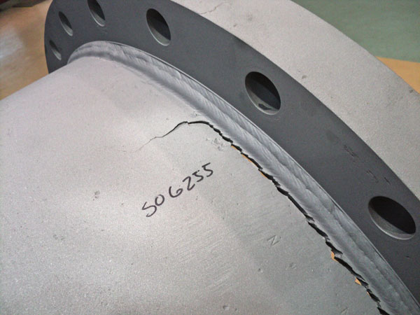 Image 1. A crack in the discharge head flange that involved fatigue failure of the weld of a pump. 