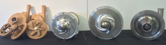 Image 2. Prototypes from four iterations involved in designing a sealless hygienic centrifugal pump. From left to right: cardboard and tape concept prototypes, aluminum concept prototype, aluminum functional prototype and stainless steel functional prototype 