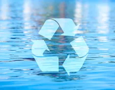 Recycyling symbol over water background