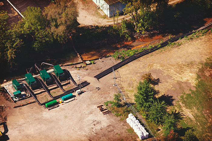 Image 1. An aerial view of the Portage Creek project shows pumps with sound-attenuated enclosures.