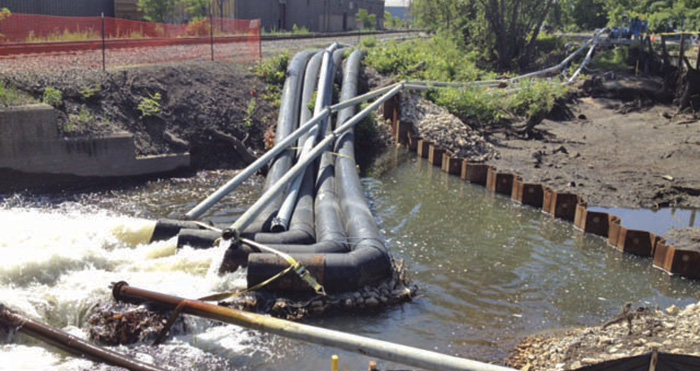 Image 2. This shows water from Portage Creek returning from the bypass area through pumps upstream