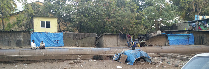 Horizontal photo of pipe in front of houses