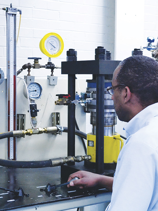 A technician tests a gasket for leak tightness using DIN-3535 method