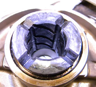 Structurally intact ceramic matrix composite bearing after four-stage testing and pump disassembly