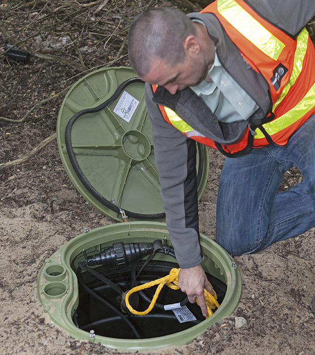 Image 5. Grinder pump startup inspection is a standard part of the protocol ensuring maximum homeowner satisfaction. (Courtesy of Environment One Corporation)