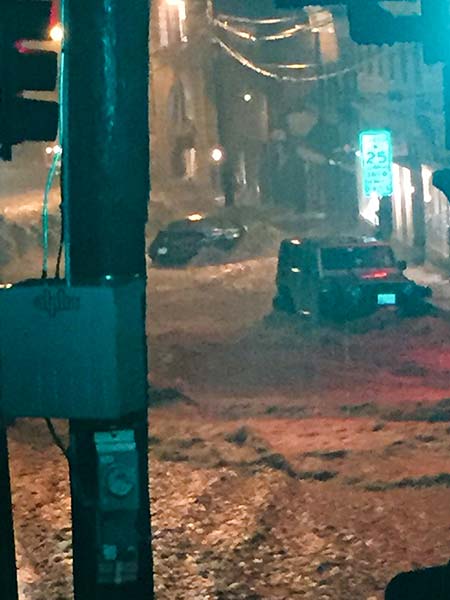 The Jeep and other car in the photo were a couple of the last two to be washed down the hill prior to the storm subsiding.