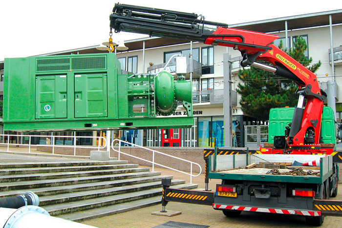 Heavy machinery moves a pump for deployment