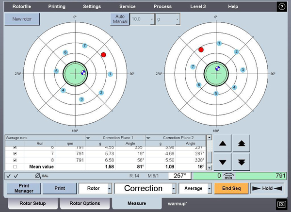 This vector display shows the marked measurements of the traversed weight and the resultant residual unbalance shown as the blue and white point within the green shaded tolerance band.