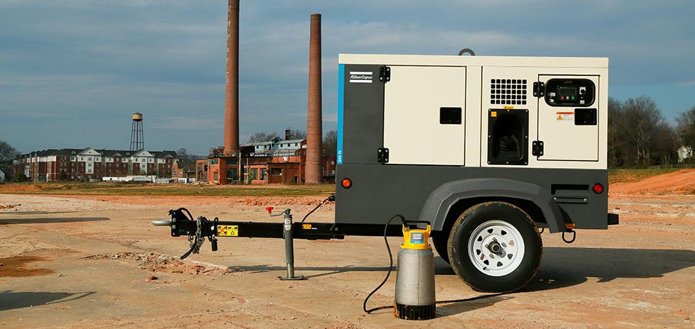 Mobile generator and submersible pumps for load sharing