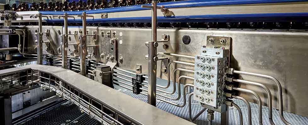 IMAGE 1: Series progressive divider valves proportion oil or grease to the various lubrication points on the machinery/equipment. (Images courtesy of Graco)