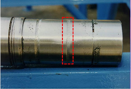 IMAGE 8: Groove worn into a pump shaft sleeve from the dynamic elastomer moving back and forth during operation