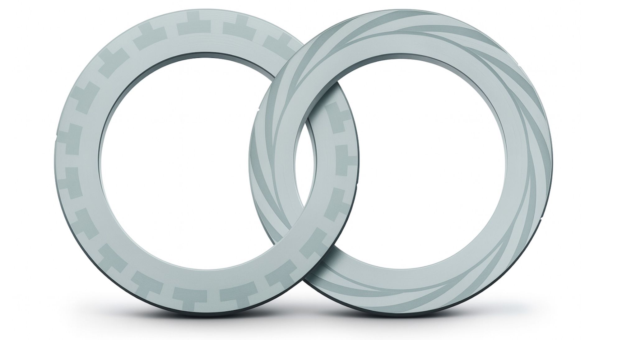 IMAGE 3: Seal face patterns designed for gas-lubricated dry gas seals. The left face features a lift-generating groove pattern, while the right face shows a spiral groove configuration to optimize gas film stability and minimize leakage.