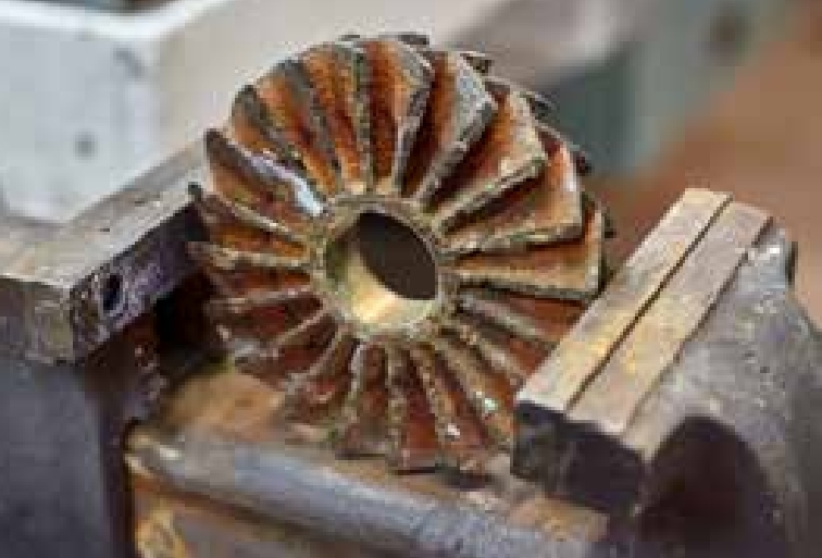 IMAGE 2: Centrifugal pump impeller that was damaged by cavitation