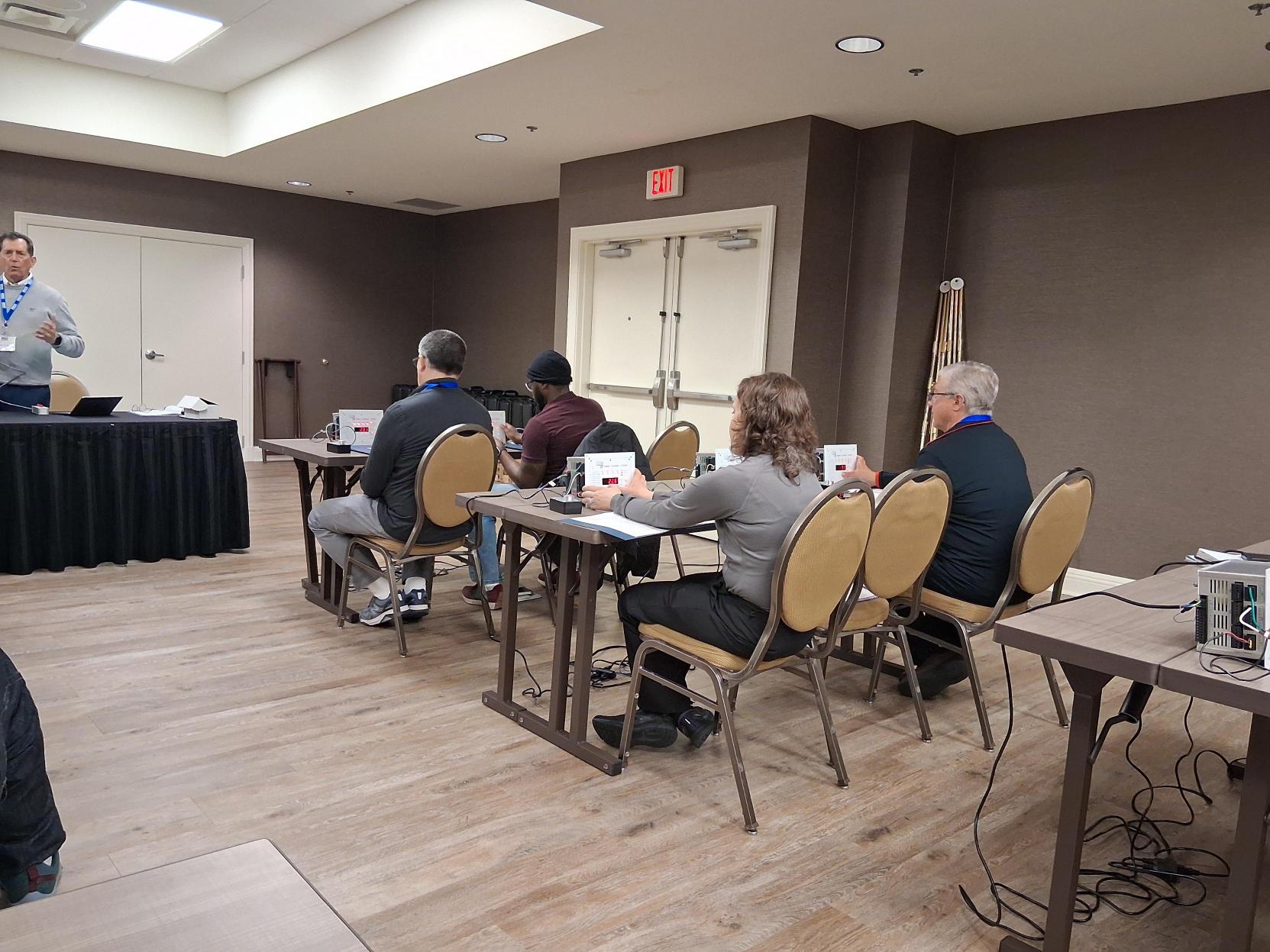 Image 5: Seminar attendees learn to perform parameter changes on pump station controllers