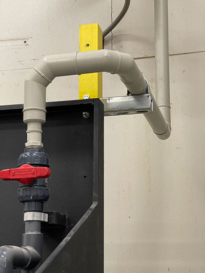 IMAGE 1: Double contained piping system and ball valve installed with proper pipe supports at a wastewater treatment plant (Images courtesy of Asahi/America, Inc.)