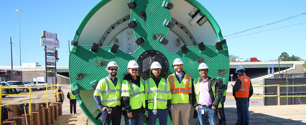 NETL project managers in front of the 135-inch Earth pressure balancing tunnel boring machine 