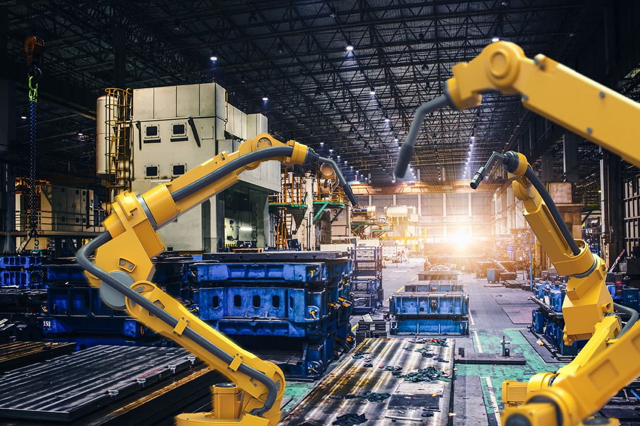 Robotic arms working in an industrial facility