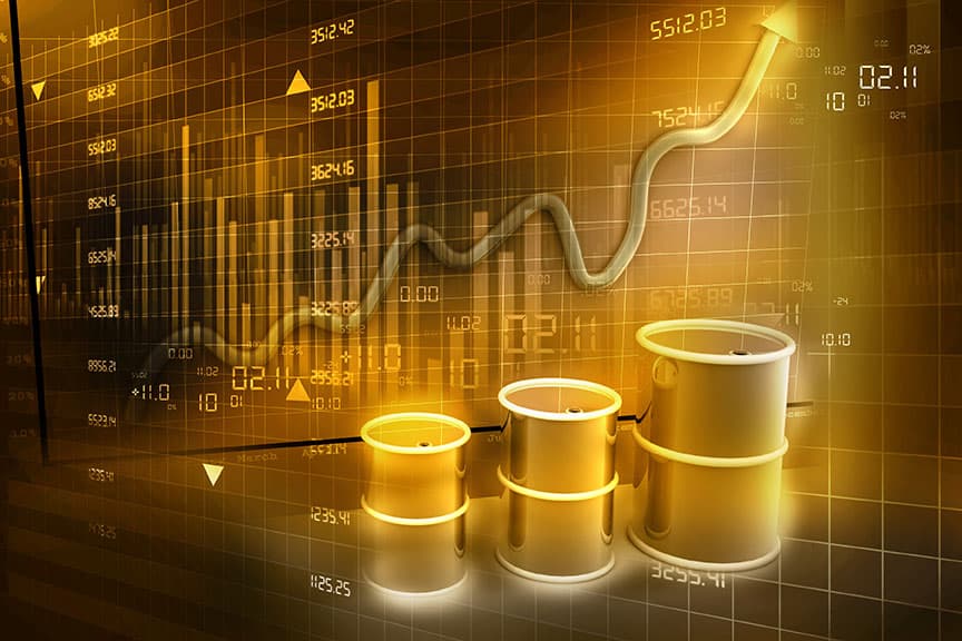 Oil barrels in front of a fluctuating financial chart