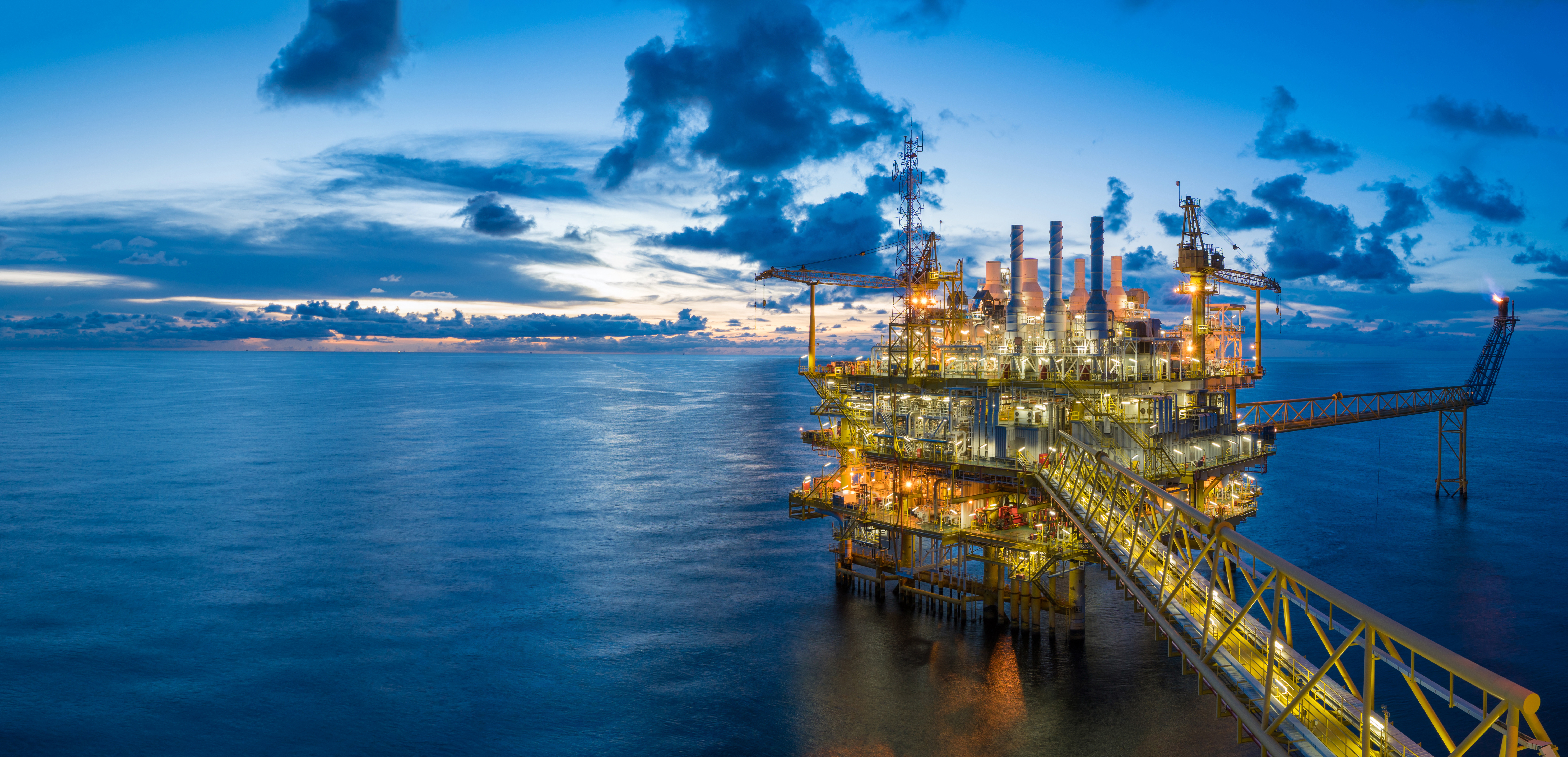offshore oil rig at dusk