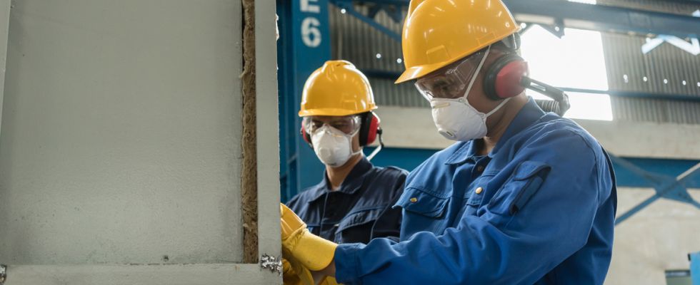 manufacturing workers wearing masks