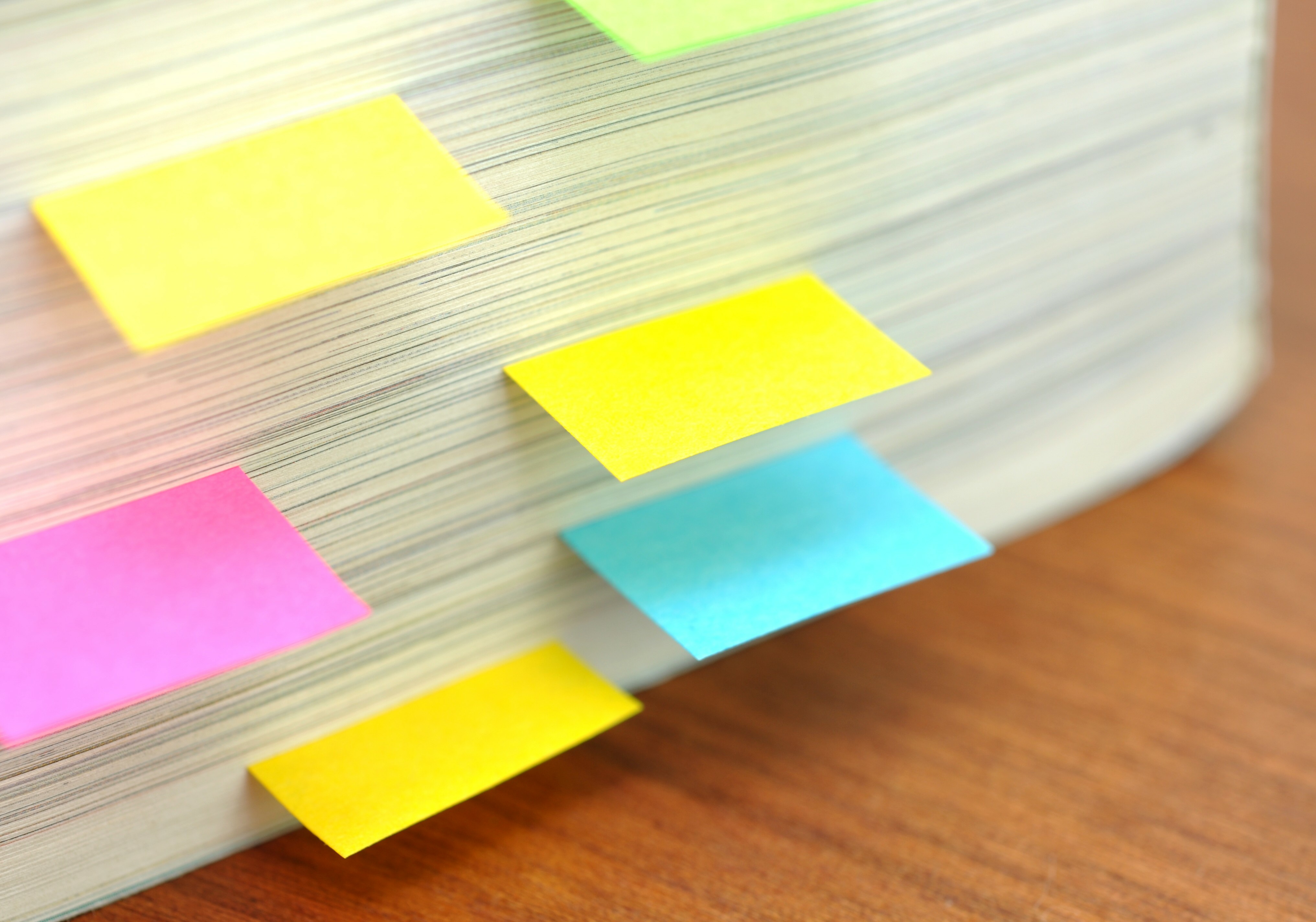 pile of paper with post-it notes