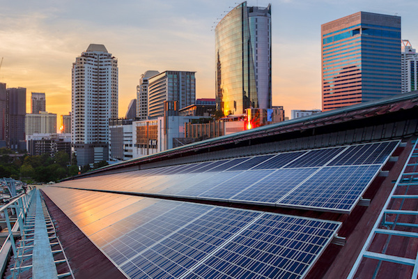 solar panels and city skyline