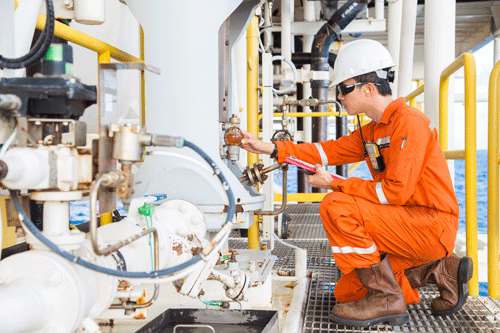 IMAGE 1: Engineer checking lubrication-oil system