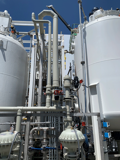 IMAGE 2: Glass-filled polyamide pneumatic actuators automating Type-21 ball valves in a lithium nickel slurry application. 