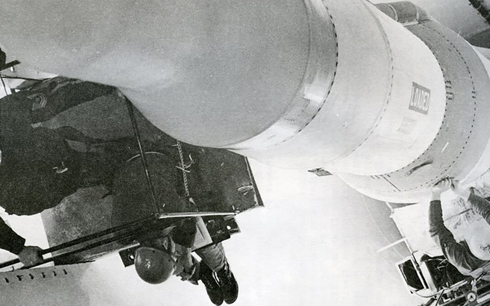 A maintenance crew works on a Minuteman II missile.
