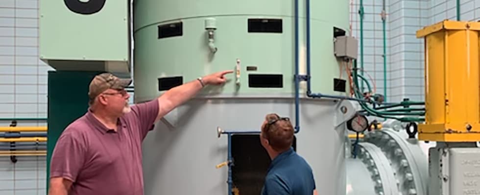 SMMWSC’s general manager, Dan Stickel, and Operations Manager Tom McLavy inspecting Pump 5 after its reinstallation