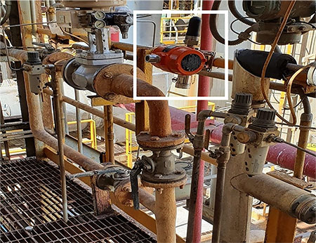 A WirelessHART gas detector deployed over a pipe flange
