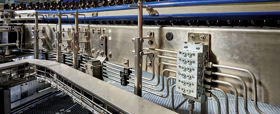 IMAGE 1: Series progressive divider valves proportion oil or grease to the various lubrication points on the machinery/equipment. (Images courtesy of Graco)