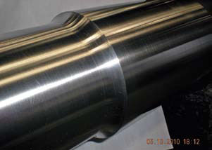 A newly manufactured shaft with the proper radius.