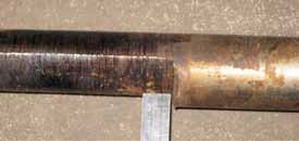 Excessive wear on one side of the line shaft caused by high radial loads.