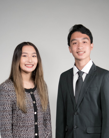 Two people smilingDescription automatically generated with medium confidence