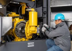 Performing maintenance on pump for water removal at a construction site