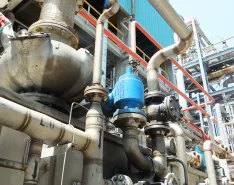 A guided piston valve controls line pressure at an oil refinery