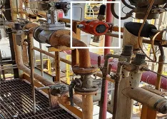 A WirelessHART gas detector deployed over a  pipe flange
