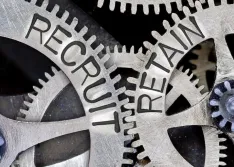 Interlocking wheels that say recruit and retain